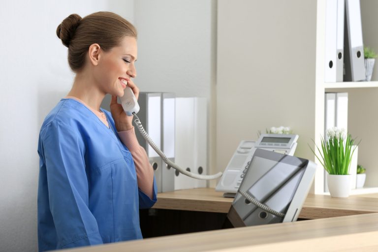 Front desk answering the phone at David Schmidt, DDS in Ypsilanti
