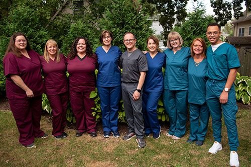 Dr. David Schmidt and the team outside his Ypsilanti dental office